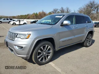 2018 Jeep Grand Cherokee Overland with VIN 1C4RJFCM3JC401399, listed as a Copart auction lot 53167035 with 87,886 mi miles and Non repairable. Bid and sale history available at DreamBid. Image 1.