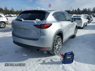 2021 Mazda CX-5 Grand Touring Reserve with VIN JM3KFBAY0M0377030, listed as a IAAI auction lot 41606709 with 39,590 mi miles. Bid and sale history available at carsss.com. Image 4.