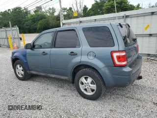 2010 Ford Escape XLS with VIN 1FMCU0C78AKD44185, listed as a Copart auction lot 60876155 with 157,399 mi miles and Salvage title. Bid and sale history available at DreamBid. Image 2.