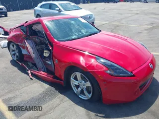 2012 Nissan 370Z z VIN JN1AZ4EH5CM561097, wystawiony jako IAAI lot #42054228 z przebiegiem 74 651 mil mil oraz . Historia ofert i sprzedaży dostępna na DreamBid. Obrazek 1.