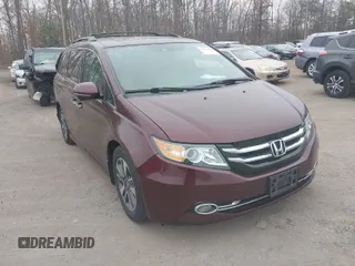 2014 Honda Odyssey Touring with VIN 5FNRL5H97EB117971, listed as a IAAI auction lot 41794324 with 198,191 mi miles and . Bid and sale history available at DreamBid. Image 1.