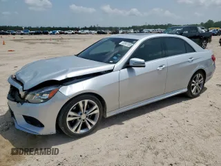 2014 Mercedes-Benz E 350 Sport with VIN WDDHF5KB6EA779828, listed as a Copart auction lot 62987085 with 128,228 mi miles and Salvage title. Bid and sale history available at DreamBid. Image 1.