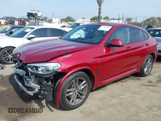 2021 BMW X4 xDrive30i with VIN 5UX2V1C09M9F29509, listed as a IAAI auction lot 42408605 with 46,992 mi miles and . Bid and sale history available at DreamBid. Image 2.