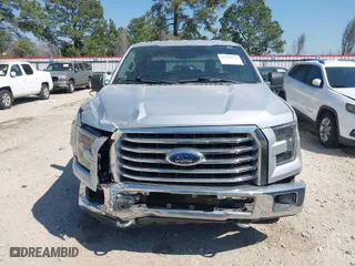 2015 Ford F-150 XLT with VIN 1FTEW1EF5FFC11899, listed as a IAAI auction lot 41770372 with 158,320 mi miles. Bid and sale history available at carsss.com. Image 13.