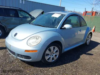 2010 Volkswagen New Beetle Coupe with VIN 3VWRW3AG2AM018644, listed as a IAAI auction lot 41815380 with 99,738 mi miles. Bid and sale history available at carsss.com. Image 2.