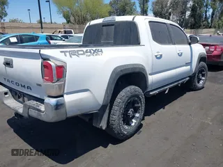 2023 Toyota Tacoma SR with VIN 3TMCZ5AN4PM558760, listed as a IAAI auction lot 42626514 with 39,335 mi miles and . Bid and sale history available at DreamBid. Image 4.