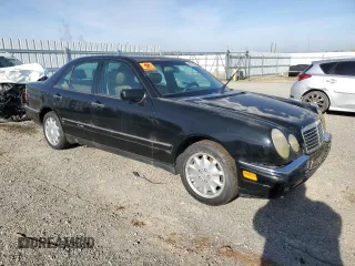 1997 Mercedes-Benz E-Class with VIN WDBJF55F5VJ028552, listed as a Copart auction lot 84172054 with 308,426 mi miles and Clean Title. Bid and sale history available at carsss.com. Image 4.
