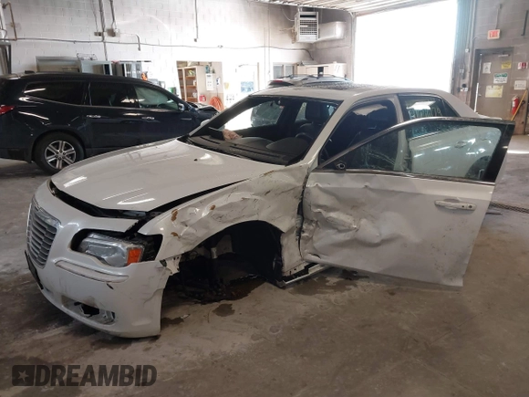 2014 Chrysler 300 with VIN 2C3CCAAGXEH217715, listed as a IAAI auction lot 41666179 with 145,744 mi miles and . Bid and sale history available at DreamBid. Image 6.
