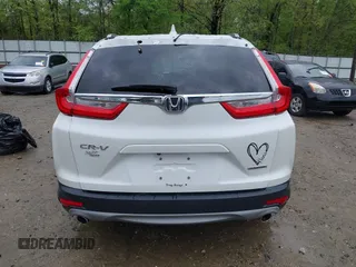 2018 Honda CR-V Touring z VIN 5J6RW1H96JL014087, wystawiony jako IAAI lot #41931640 z przebiegiem Nie podano mil oraz . Historia ofert i sprzedaży dostępna na DreamBid. Obrazek 17.