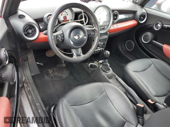 2012 MINI Convertible with VIN WMWZN3C58CT134224, listed as a Copart auction lot 57610015 with 141,394 mi miles and Salvage title. Bid and sale history available at DreamBid. Image 8.