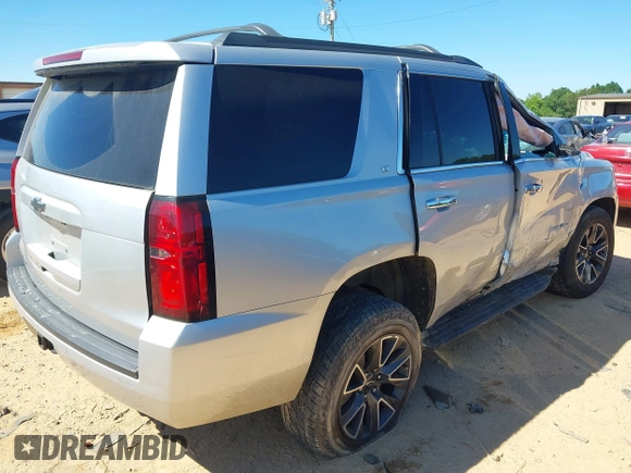 2020 Chevrolet Tahoe LT with VIN 1GNSKBKC5LR121085, listed as a IAAI auction lot 42341677 with 123,579 mi miles and . Bid and sale history available at DreamBid. Image 4.