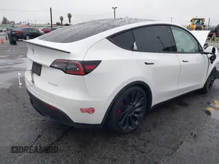 2022 Tesla Model Y Performance with VIN 7SAYGDEFXNF384268, listed as a IAAI auction lot 41558359 with 33,870 mi miles and . Bid and sale history available at DreamBid. Image 4.