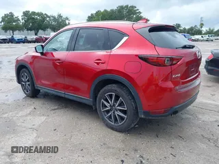 2018 Mazda CX-5 Grand Touring with VIN JM3KFADM5J0437365, listed as a IAAI auction lot 42657919 with 96,760 mi miles and . Bid and sale history available at DreamBid. Image 3.