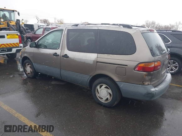1999 Toyota Sienna LE with VIN 4T3ZF13C9XU164032, listed as a IAAI auction lot 41916673 with 296,628 mi miles and . Bid and sale history available at DreamBid. Image 3.
