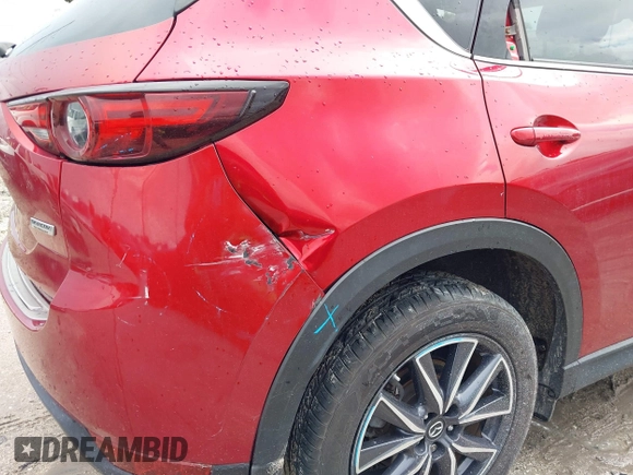 2018 Mazda CX-5 Grand Touring with VIN JM3KFADM5J0437365, listed as a IAAI auction lot 42657919 with 96,760 mi miles and . Bid and sale history available at DreamBid. Image 6.