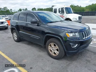2016 Jeep Grand Cherokee Laredo z VIN 1C4RJEAG0GC320683, wystawiony jako IAAI lot #42379025 z przebiegiem 124 750 mil mil oraz . Historia ofert i sprzedaży dostępna na DreamBid. Obrazek 1.