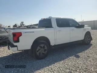 2023 Ford F-150 Lightning Pro z VIN 1FT6W1EV3PWG34249, wystawiony jako Copart lot #46901535 z przebiegiem 9 389 mil mil oraz Szkoda całkowita • Salvage title. Historia ofert i sprzedaży dostępna na DreamBid. Obrazek 3.