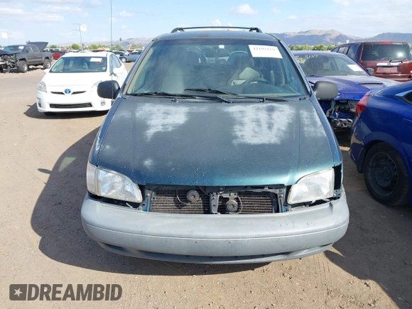 1998 Toyota Sienna LE with VIN 4T3ZF13CXWU049115, listed as a IAAI auction lot 42193159 with 194,313 mi miles and . Bid and sale history available at DreamBid. Image 6.