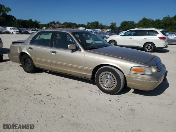 2000 Ford Crown Victoria with VIN 2FAFP73W4YX216080, listed as a Copart auction lot 53774835 with 144,404 mi miles and Salvage Title. Bid and sale history available at carsss.com. Image 4.