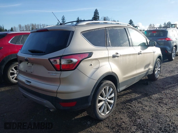 2017 Ford Escape Titanium with VIN 1FMCU0JD0HUB79739, listed as a IAAI auction lot 41807975 with 121,902 mi miles. Bid and sale history available at carsss.com. Image 4.