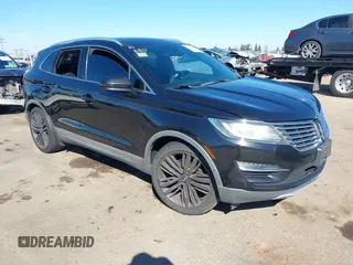 2015 Lincoln MKC with VIN 5LMTJ2AH6FUJ13505, listed as a IAAI auction lot 41871254 with 107,924 mi miles. Bid and sale history available at carsss.com. Image 1.