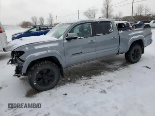 2021 Toyota Tacoma SR5 с VIN 5TFDZ5BN5MX057899, выставлен на аукционе Copart как лот 89255235 с пробегом 74 834 миль миль и Списание • Salvage title. История ставок и продаж доступна на DreamBid. Изображение 1.
