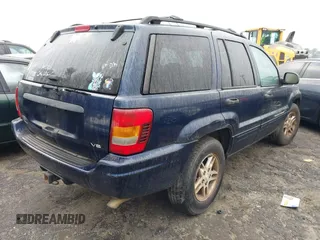 2004 Jeep Grand Cherokee Laredo with VIN 1J4GW48N04C220886, listed as a IAAI auction lot 41473522 with 146,156 mi miles. Bid and sale history available at carsss.com. Image 4.