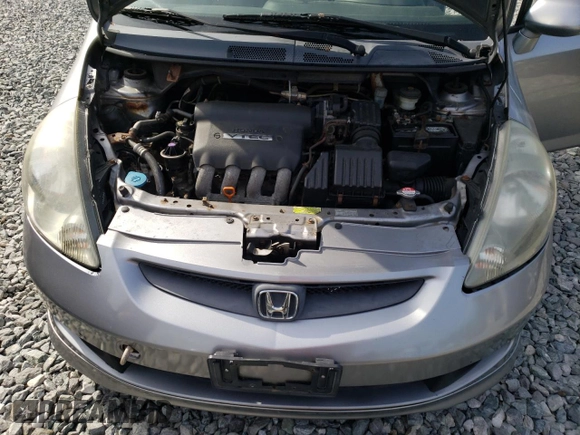 2007 Honda Fit Sport z VIN JHMGD37677S001013, wystawiony jako Copart lot #58792605 z przebiegiem 157 960 mil mil oraz Czysty tytuł • Clean title. Historia ofert i sprzedaży dostępna na DreamBid. Obrazek 11.