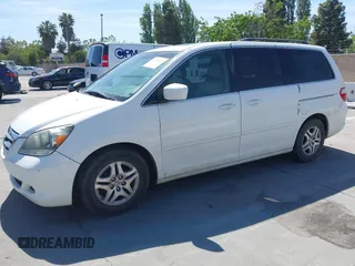 2005 Honda Odyssey EX-L with VIN 5FNRL38605B045246, listed as a IAAI auction lot 42183883 with 164,072 mi miles and . Bid and sale history available at carsss.com. Image 2.