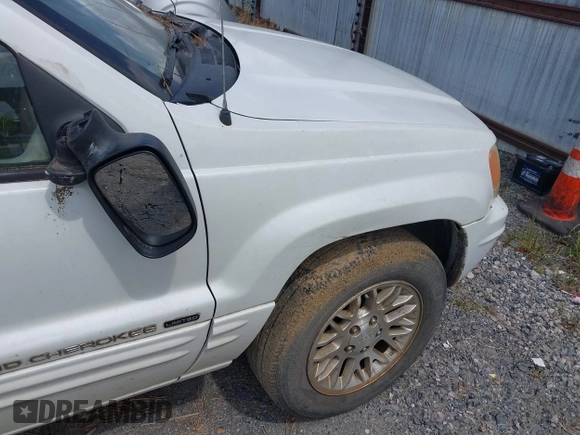 2002 Jeep Grand Cherokee Limited z VIN 1J4GX58N62C195783, wystawiony jako IAAI lot #42745397 z przebiegiem 242 502 mil mil oraz . Historia ofert i sprzedaży dostępna na DreamBid. Obrazek 16.
