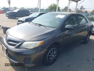 2011 Toyota Corolla L with VIN JTDBU4EE3BJ090749, listed as a IAAI auction lot 42106633 with 209,824 mi miles. Bid and sale history available at carsss.com. Image 21.