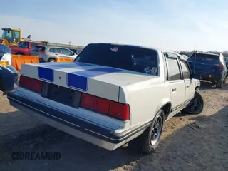 1988 Chevrolet Celebrity z VIN 1G1AW51W4J6137291, wystawiony jako IAAI lot #41777521 z przebiegiem 163 299 mil mil oraz . Historia ofert i sprzedaży dostępna na DreamBid. Obrazek 4.