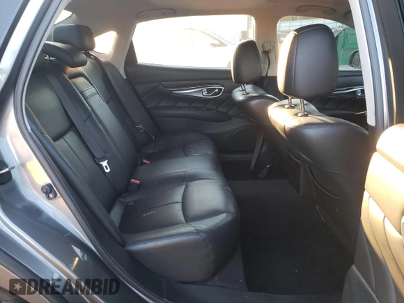 2015 Infiniti Q70 z VIN JN1BY1PR0FM830851, wystawiony jako Copart lot #87606685 z przebiegiem 116 148 mil mil oraz Szkoda całkowita • Salvage title. Historia ofert i sprzedaży dostępna na DreamBid. Obrazek 10.