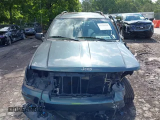 2004 Jeep Grand Cherokee Laredo with VIN 1J4GX48S34C192181, listed as a IAAI auction lot 42320368 with 181,415 mi miles and . Bid and sale history available at DreamBid. Image 12.
