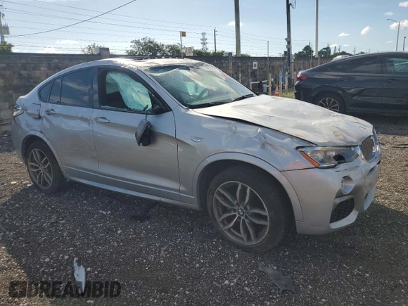 2017 BMW X4 M40i with VIN 5UXXW7C51H0U25511, listed as a Copart auction lot 77492894 with 94,003 mi miles and Salvage Title. Bid and sale history available at carsss.com. Image 4.