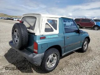 1996 Chevrolet Tracker z VIN 2CNBJ1869T6903615, wystawiony jako Copart lot #49690055 z przebiegiem 144 821 mil mil oraz Szkoda całkowita • Salvage title. Historia ofert i sprzedaży dostępna na DreamBid. Obrazek 3.