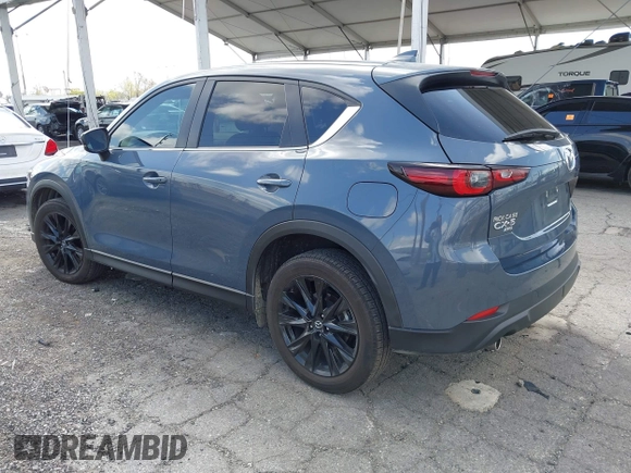 2023 Mazda CX-5 S Carbon Edition z VIN JM3KFBCM5P0179543, wystawiony jako IAAI lot #41950082 z przebiegiem 31 573 mil mil oraz . Historia ofert i sprzedaży dostępna na DreamBid. Obrazek 3.