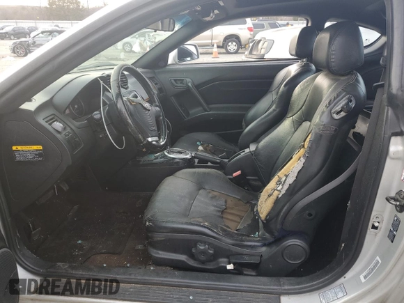 2003 Hyundai Tiburon GT z VIN KMHHN65F63U064962, wystawiony jako Copart lot #44804045 z przebiegiem 186 171 mil mil oraz Szkoda całkowita • Salvage title. Historia ofert i sprzedaży dostępna na DreamBid. Obrazek 7.