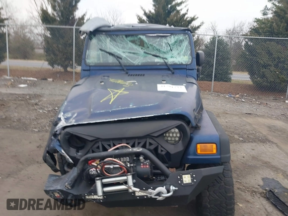 2003 Jeep Wrangler X with VIN 1J4FA39S23P300447, listed as a IAAI auction lot 41791733 with 165,576 mi miles. Bid and sale history available at carsss.com. Image 12.