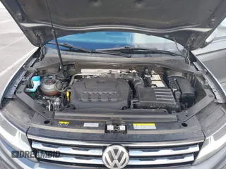 2021 Volkswagen Tiguan S with VIN 3VV1B7AX8MM016874, listed as a IAAI auction lot 41633090 with 76,857 mi miles and . Bid and sale history available at DreamBid. Image 10.
