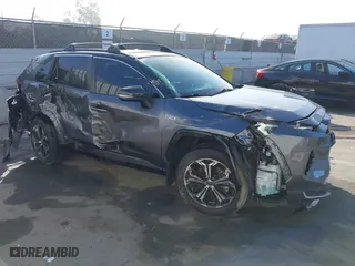 2021 Toyota RAV4 Prime XSE with VIN JTMFB3FV7MD009740, listed as a IAAI auction lot 41666510 with 59,950 mi miles. Bid and sale history available at carsss.com. Image 1.