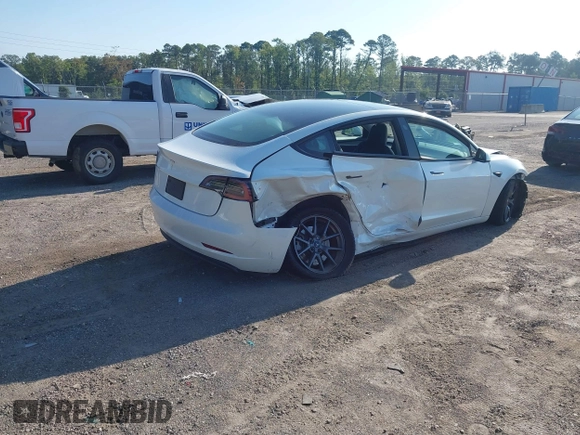 2023 Tesla Model 3 with VIN 5YJ3E1EA9PF557880, listed as a IAAI auction lot 42481413 with 40,582 mi miles and . Bid and sale history available at DreamBid. Image 4.