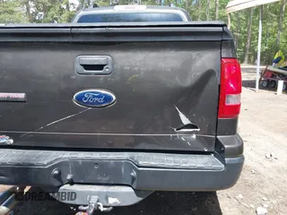 2007 Ford Explorer Sport Trac XLT z VIN 1FMEU31K37UA07311, wystawiony jako IAAI lot #42352365 z przebiegiem 167 282 mil mil oraz . Historia ofert i sprzedaży dostępna na DreamBid. Obrazek 12.