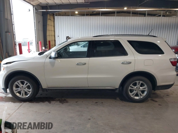 2012 Dodge Durango SXT with VIN 1C4RDJAGXCC295138, listed as a IAAI auction lot 42333094 with 96,581 mi miles and . Bid and sale history available at DreamBid. Image 14.