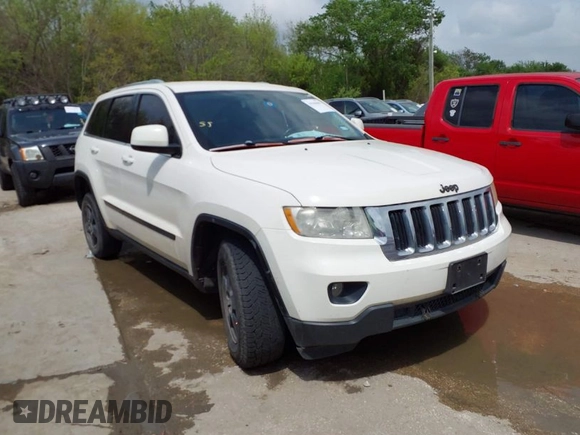 2012 Jeep Grand Cherokee Laredo with VIN 1C4RJFAG8CC124877, listed as a IAAI auction lot 41940603 with 254,356 mi miles. Bid and sale history available at carsss.com. Image 1.