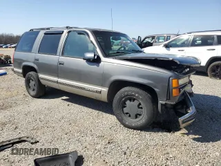 1999 GMC Yukon with VIN 1GKEC13R9XJ805842, listed as a Copart auction lot 48952625 with 259,149 mi miles and Clean Title. Bid and sale history available at carsss.com. Image 4.