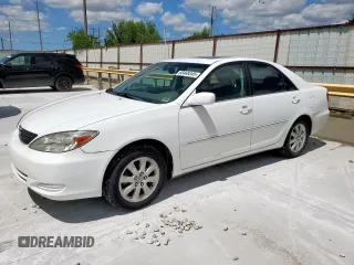 2002 Toyota Camry LE z VIN 4T1BE32K52U027812, wystawiony jako Copart lot #60468345 z przebiegiem 174 180 mil mil oraz Czysty tytuł • Clean title. Historia ofert i sprzedaży dostępna na DreamBid. Obrazek 1.