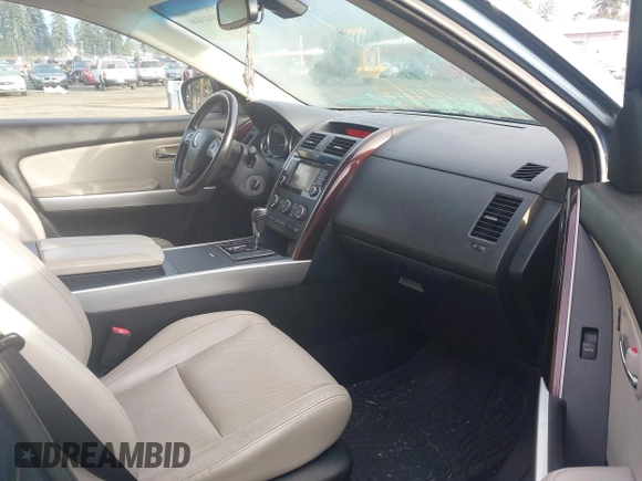2014 Mazda CX-9 Grand Touring with VIN JM3TB3DV2E0435230, listed as a IAAI auction lot 41041440 with 145,538 mi miles and . Bid and sale history available at DreamBid. Image 5.