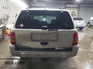 1998 Jeep Grand Cherokee Laredo with VIN 1J4GZ48S3WC269693, listed as a Copart auction lot 85026074 with 308,791 mi miles and Salvage Title. Bid and sale history available at carsss.com. Image 6.