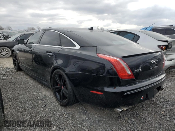 2014 Jaguar XJ with VIN SAJWA2EKXEMV64494, listed as a Copart auction lot 82634004 with 119,811 mi miles and Clean title. Bid and sale history available at DreamBid. Image 2.